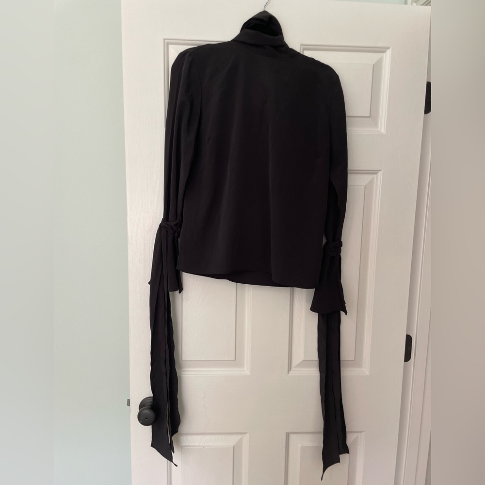 Black silk blouse with tie at neck and tie on sleeves